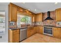 Well-lit kitchen featuring custom cabinets, granite countertops, stainless steel appliances at 2340 W Myrtle Dr, Chandler, AZ 85248