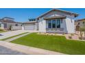 Single-Gathering home with attractive modern architecture, landscaping and a two-car garage at 24022 S 218Th Pl, Queen Creek, AZ 85142