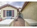 Cozy front porch with seating, decorative accents, and a welcoming entryway at 27158 W Potter Dr, Buckeye, AZ 85396
