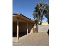 Covered carport area offering ample parking space and privacy wall at 3434 W Augusta Ave, Phoenix, AZ 85051