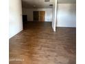 Spacious living room with hardwood flooring and bright natural light at 3434 W Augusta Ave, Phoenix, AZ 85051