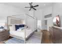 Bright main bedroom boasts vaulted ceiling, wood floors, ceiling fan, and ensuite bathroom at 4809 E Red Range Way, Cave Creek, AZ 85331