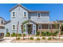 Charming two-story home featuring a combination of gray and brown siding with manicured landscaping at 4833 S Ferric --, Mesa, AZ 85212