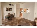 Inviting dining area featuring a modern ceiling fan and decorative wall art at 520 S Evergreen Rd, Tempe, AZ 85288