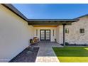 Inviting entryway with stylish double doors and a cozy seating area at 5425 E Avalon Dr, Phoenix, AZ 85018