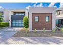 Modern home exterior boasting clean lines, desert landscaping, and wood accents at 6142 E Alta Hacienda Dr, Scottsdale, AZ 85251