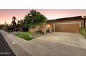 Beautiful single-story home with desert landscaping, a two-car garage, and a welcoming entrance at 7710 N Via De Fonda St, Scottsdale, AZ 85258