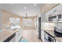 Bright and inviting kitchen with modern appliances and countertops, perfect for cooking at 8606 W Caribbean Ln, Peoria, AZ 85381