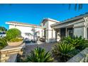 Inviting covered front porch with neutral furniture and views of the well maintained front yard at 9721 E Juanita Ave, Mesa, AZ 85209