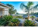 Inviting front yard with desert landscaping and a view of the neighborhood street at 9721 E Juanita Ave, Mesa, AZ 85209