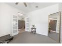 Versatile flex space with a view of another room through decorative glass doors at 9856 E Palladium Dr, Mesa, AZ 85212
