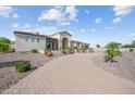 Beautiful exterior view of a single story home with a brick driveway and well-maintained landscaping at 10448 E Glencove St, Mesa, AZ 85207