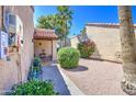 Private courtyard featuring desert landscaping and a covered entryway, perfect for outdoor relaxation and curb appeal at 11144 N 109Th Way, Scottsdale, AZ 85259