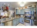 Modern kitchen featuring stainless steel appliances, granite countertops, and open layout, perfect for cooking and entertaining at 11144 N 109Th Way, Scottsdale, AZ 85259