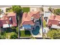 A bird's-eye view of the property with a sparkling pool, well-maintained landscaping and tiled roof at 1349 N Lakeshore Dr, Chandler, AZ 85226