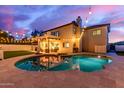 Outdoor space features a refreshing pool, and covered patio, perfect for relaxing and entertaining at 1349 N Lakeshore Dr, Chandler, AZ 85226