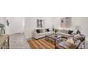 Cozy living room featuring neutral decor, comfortable seating, and stylish accents at 16010 N 74Th Ln, Peoria, AZ 85382