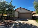 Inviting single-story home featuring a neutral color palette, a two-car garage and a well-maintained front yard at 1836 N Stapley Dr # 88, Mesa, AZ 85203