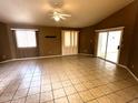 Open living room featuring tiled floors, recessed lighting, and sliding glass doors at 1836 N Stapley Dr # 88, Mesa, AZ 85203