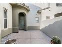 Charming courtyard entrance with tiled flooring and desert landscaping at 20802 N Grayhawk Dr # 1123, Scottsdale, AZ 85255