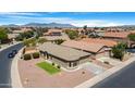 Expansive aerial view shows the property, community, and mountain views beyond at 22576 N Davis Way, Maricopa, AZ 85138