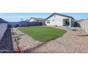 Spacious backyard featuring a well-maintained lawn and a playset at 23937 W Hopi St, Buckeye, AZ 85326