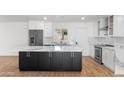 Bright modern kitchen with a large island, stainless steel appliances, and plenty of cabinet space at 2614 E Mountain View Rd, Phoenix, AZ 85028