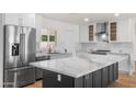 Bright modern kitchen with a large island, stainless steel appliances, and plenty of cabinet space at 2614 E Mountain View Rd, Phoenix, AZ 85028