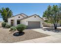 Charming single-story home with a two-car garage and desert landscaping at 2641 E Brooks St, Gilbert, AZ 85296