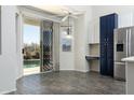 Bright kitchen with sleek stainless steel appliances and backyard views through sliding glass doors at 2641 E Brooks St, Gilbert, AZ 85296