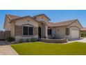 Charming single-story home showcasing a meticulously maintained front yard and welcoming entrance at 2839 S Copperwood --, Mesa, AZ 85212