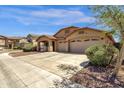 Charming single-story home with a well-maintained lawn and a spacious three car driveway at 4723 W Samantha Way, Laveen, AZ 85339