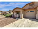 Charming single-story home with a well-maintained lawn and a spacious two car driveway at 4723 W Samantha Way, Laveen, AZ 85339