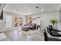 Inviting living room filled with light with modern flooring, a comfortable sofa, stylish coffee table, and modern details at 4901 S Calle Los Cerros Dr # 119, Tempe, AZ 85282