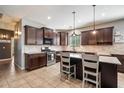Well-equipped kitchen with granite counters, an island, and stainless-steel appliances at 5543 W Kowalsky Ln, Laveen, AZ 85339