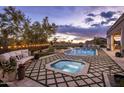 Luxurious backyard with large pool, hot tub, and outdoor lounge area perfect for entertaining at 7327 E La Junta Rd, Scottsdale, AZ 85255