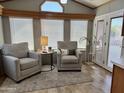 Cozy living room featuring comfortable seating, a bright window, and stylish decor at 7750 E Broadway Rd # 774, Mesa, AZ 85208