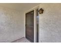 Exterior front door showing front porch, screen door and exterior wall texture at 8225 N Central Ave # 44, Phoenix, AZ 85020