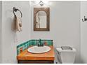 Bathroom sink featuring a tile countertop and backsplash at 8844 S 51St St # 3, Phoenix, AZ 85044