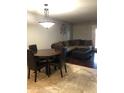 Inviting living room with wood floors, comfortable seating, and a stylish chandelier at 913 E Beryl Ave, Phoenix, AZ 85020