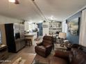 Spacious living area opens to the modern kitchen with stainless steel appliances at 9302 E Broadway Rd # 49, Mesa, AZ 85208