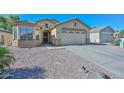 Charming one-story home with a two car garage and low maintenance landscaping at 13349 W Boca Raton Rd, Surprise, AZ 85379