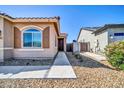 Inviting home entrance with desert landscaping and a well-maintained walkway at 16593 W Alameda Rd, Surprise, AZ 85387