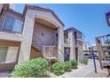 Attractive condo exterior with stairs leading to units and desert landscaping at 17017 N 12Th St # 2117, Phoenix, AZ 85022