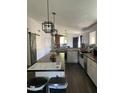 Well-lit kitchen featuring a spacious island, modern appliances, and a farmhouse sink at 2249 E Pinto Dr, Gilbert, AZ 85296