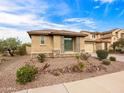 Charming single-story home with desert landscaping, a stone facade, and a well-maintained exterior at 25540 N 103Rd Dr, Peoria, AZ 85383