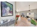 Open-concept living area with high ceilings, neutral walls, and stylish decor at 3234 E Briarwood Ter, Phoenix, AZ 85048
