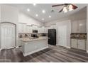 Spacious kitchen featuring granite countertops, stainless steel appliances, and dark wood floors at 3580 E Kesler Ln, Gilbert, AZ 85295