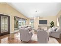 Bright living room featuring large windows, neutral furniture, and modern lighting at 4233 W Michigan Ave, Glendale, AZ 85308