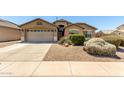 Inviting exterior view of a well-kept single-story house with desert landscaping at 4617 W Alicia Dr, Laveen, AZ 85339